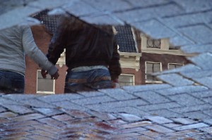 holding hands--reflection in a puddle