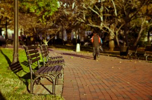 park bench with a guy walking away