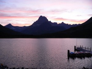 mountain with lake and a dock