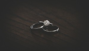 wedding rings on a brown coffee table