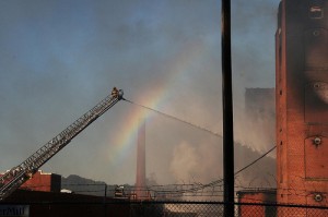 rainbow over a fire ladder