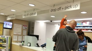 father and son at the pharmacy